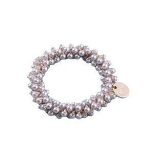 Elegant hand-woven grey pearl hair tie scrunchie with a round metallic gold tag