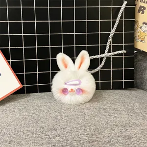 Close-up detail of a cute white plush rabbit charm featuring a purple hair clip accessory
