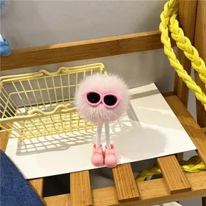 Cute pink fuzzy pompom doll keychain with sunglasses for bags, backpacks and car keys.