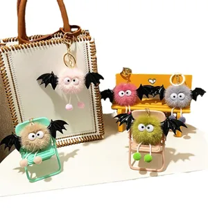 Cute colorful plush monster keychain charms with bat wings for stylish bag decor