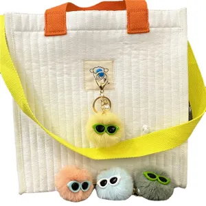 Ugly-cute plush monster keychain ball bag charm with sunglasses and pearl detail