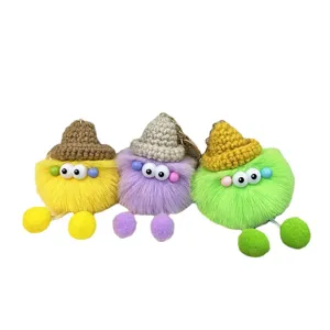 Cute colorful fuzzy monster plush keychains with mini knitted hats and pom-pom charms