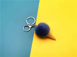 Close-up of a blue plush ice cream cone keychain on a vibrant split background