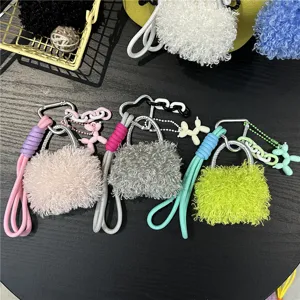 Macro view of various colorful fluffy bag charms featuring cute balloon dog accessories