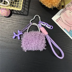 Detailed view of the purple plush mini bag charm with a cute balloon dog pendant