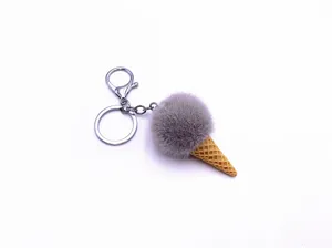 Close-up of cute grey plush ice cream cone keychain with silver lobster clasp