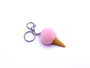 Detail view of a cute pink plush ice cream cone keychain with silver metal clasp.