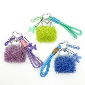 Colorful fluffy bag charms with balloon dog pendants and heart-shaped clips