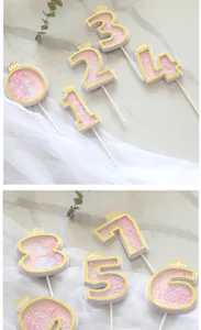 Detail view of creative pink glitter number cake toppers 0-9 with golden crown decoration