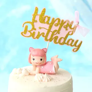 Close-up of a pink glittery Happy Birthday cake topper with a cute girl figurine.