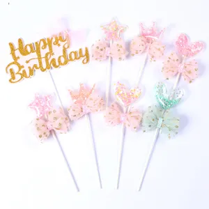 Glitter hearts stars and crown cake toppers with decorative bows for birthday parties
