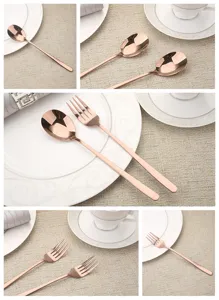 Close-up detail of rose gold stainless steel spoon and fork on elegant table setting