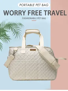 Close-up detail of the breathable woven pet carrier bag in off-white with sturdy handles.