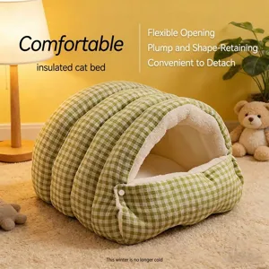 Close-up of cozy green plaid insulated cat bed with plush lining on a rug