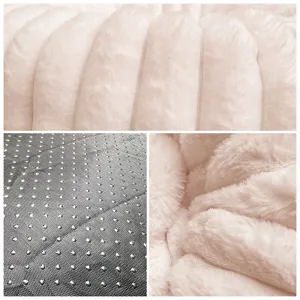 Close-up detail shot of soft plush pet bed fabric, showing thick furry texture and non-slip base.