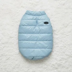 Detailed view of light blue winter pet padded vest, warm dog and cat clothing with leash hole.