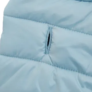 Light blue warm pet winter vest coat detail with a leash hole for small dogs and cats.