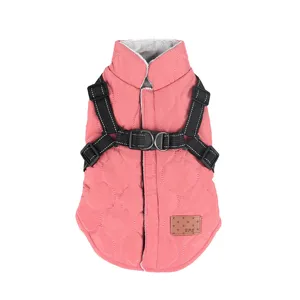 Pink quilted dog winter coat with integrated harness, warm fleece lined vest for small pets.