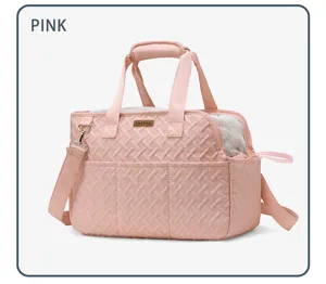 Close-up of pink quilted pet carrier bag with breathable mesh windows and pockets.