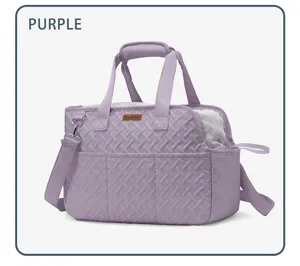 Portable purple quilted pet carrier bag with breathable mesh and shoulder strap for travel.
