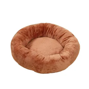 Cozy round plush pet bed for small dogs and cats, warm winter dog nest in brown color.