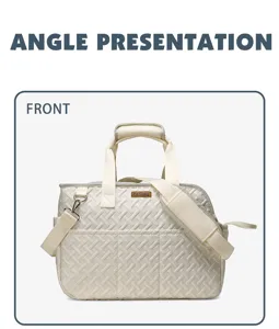 Front detail view of quilted pet carrier bag in beige canvas with handles and strap.
