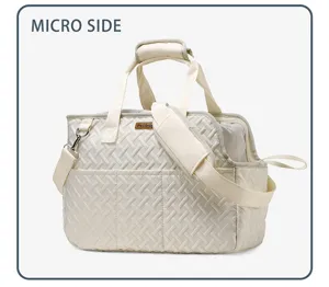 Detailed view of quilted pet carrier bag featuring breathable mesh side and sturdy strap.