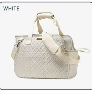 Portable white quilted pet carrier bag with shoulder strap for travel and outdoor walks.