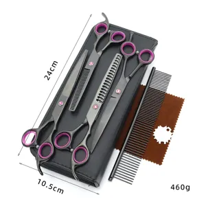 Detailed view of pet grooming scissors set, including professional shears, comb, and cloth.