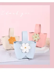 Elegant leather wedding candy gift bags with flower decor in pastel assorted colors