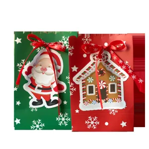 Festive Christmas gift bags featuring Santa Claus and gingerbread house with red ribbons
