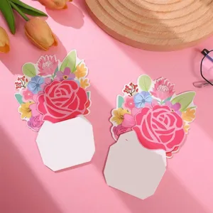 Detail of a floral pop-up greeting card with a large pink rose and writing area.