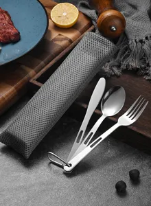Detail view of hollow stainless steel camping cutlery set with grey mesh storage bag