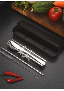 Detailed arrangement of stainless steel cutlery next to a sleek black portable box