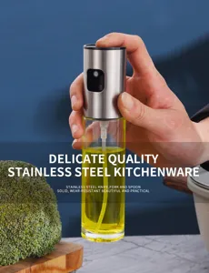 Detailed close-up of a hand pressing a high-quality 304 stainless steel oil sprayer