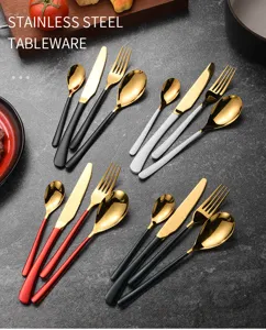 Modern gold stainless steel cutlery sets with black, white, red, and green handles