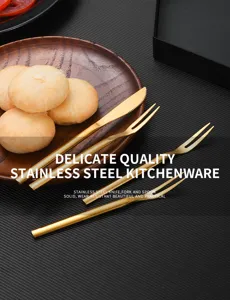 Close-up detail of golden stainless steel mooncake knife and fork set on plate