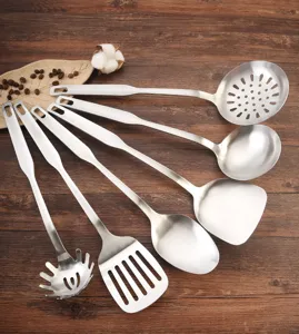 Detail view of 6-piece stainless steel kitchen utensil set on wooden background
