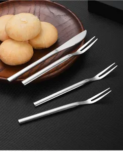 Stainless steel mooncake cutlery set with one knife and three fruit forks on a plate
