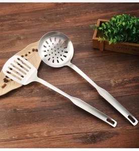 Close-up detail of the durable brushed stainless steel finish and ergonomic one-piece handle.
