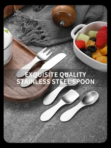 Close-up of 304 stainless steel mini dessert spoon and fork set in a lifestyle setting