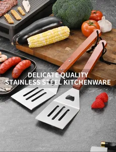 Professional stainless steel BBQ spatulas with wooden handles for outdoor grilling