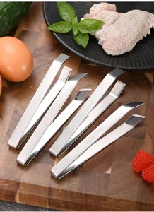 Professional stainless steel meat tweezers and fish bone remover shown on wooden board