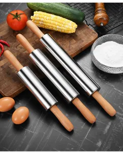 Set of three stainless steel rolling pins with wooden handles in kitchen scene