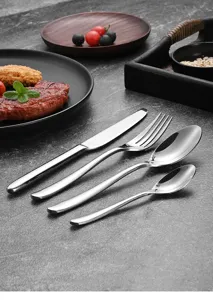 Detailed macro view of 304 stainless steel cutlery set with high-mirror polish finish