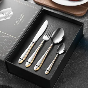 Premium stainless steel cutlery set with elegant gold line detail in a black gift box