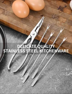 Professional detail of stainless steel seafood tool set including crab cracker and four forks.