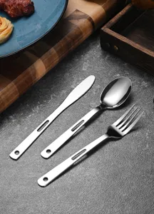 Close-up detail of stainless steel travel cutlery set with hollowed handles and polished finish