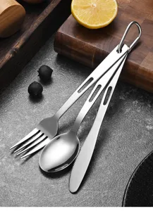 Portable camping stainless steel cutlery set with fork, spoon, and knife close-up
