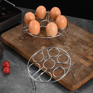 Durable 304 stainless steel egg steaming rack holding 7 eggs in a kitchen setting